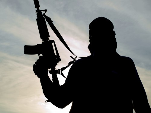 Silhouette of soldier - Terrorism: Then and Now