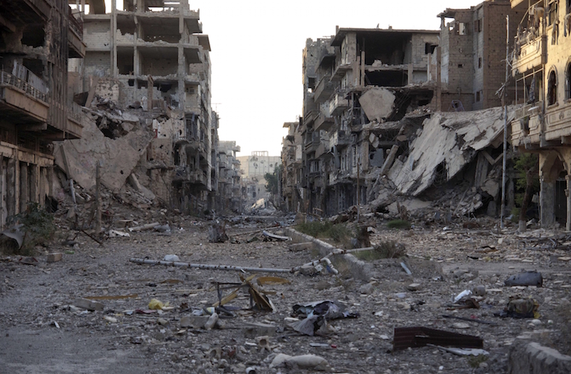 Damaged buildings and debris in Deir al-Zor, June 13, 2013.Picture taken June 13, 2013. REUTERS/Khalil Ashawi