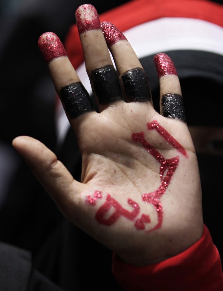  The lure of power in Yemen: A woman shows her palm during a demonstration to demand the ouster of Yemen's President Ali Abdullah Saleh in the southern city of Taiz June 14, 2011. The writing reads "The freedom". Image ©: ibtimes mpc-journal.org