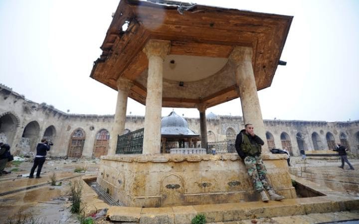 Aleppo: Meltdown of Humanity - MPC Journal - HAKIM KHATIB - Forces loyal to Syria's President Bashar al-Assad stand inside the Umayyad mosque CREDIT: REUTERS 