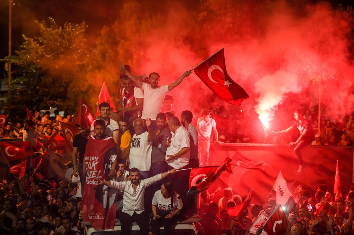 People celebrate after Binali Yildirim, who was favored by President Recep Tayyip Erdogan, conceded his defeat in the rerun of the mayoral election in Istanbul, Turkey – © Image: Burak Kara / Getty Images